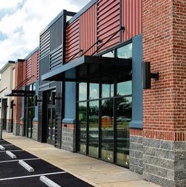 Empty storefronts with glass windows and doors.