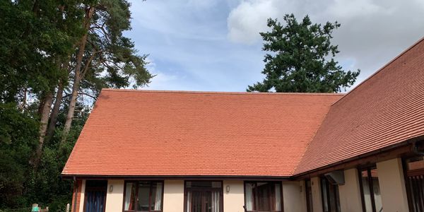 Professionally cleaned roof exhibiting a pristine, restored appearance and enhanced aesthetic appeal
