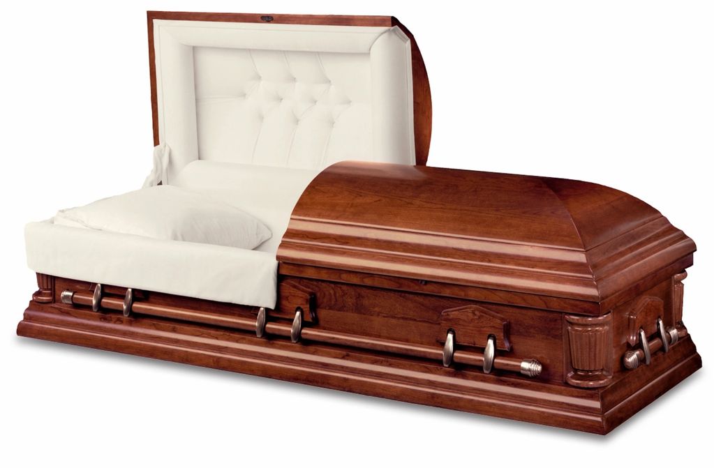 Elegant wooden casket with white interior lining.