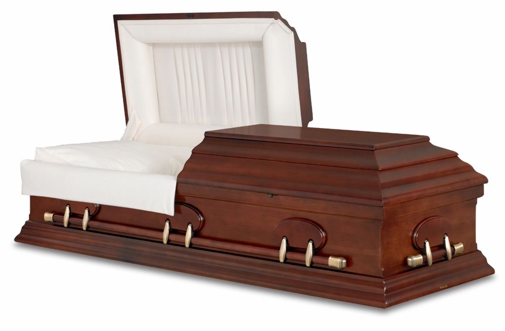 Wooden coffin with white interior lining.