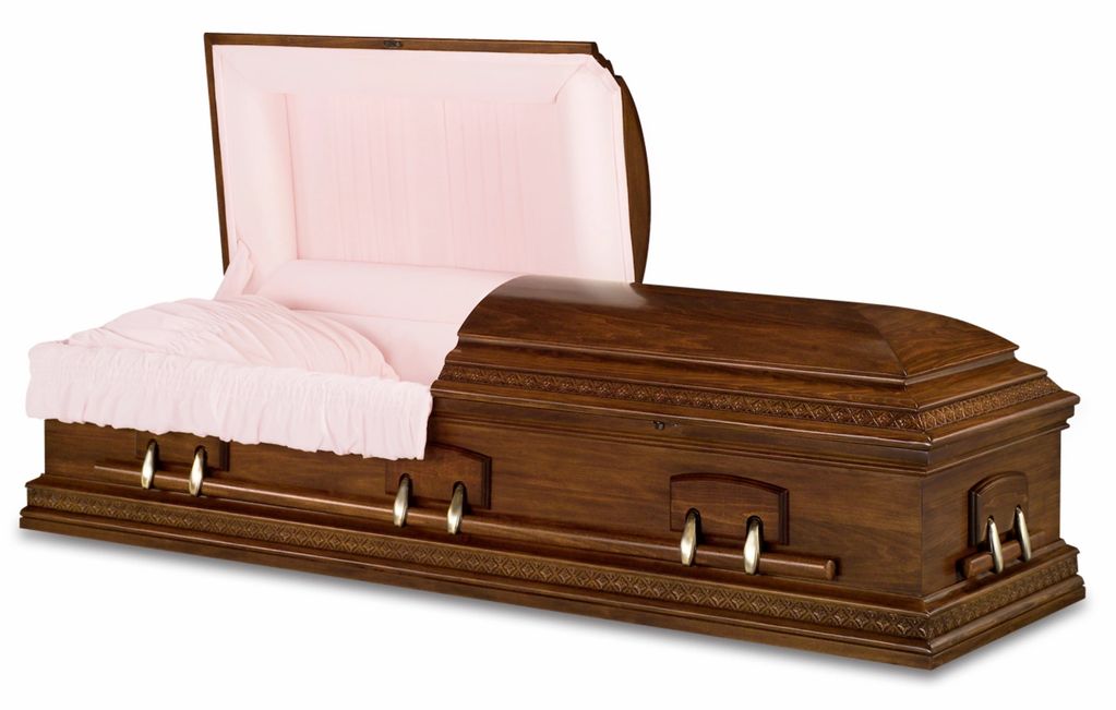 Open wooden casket with pink interior cushioning.