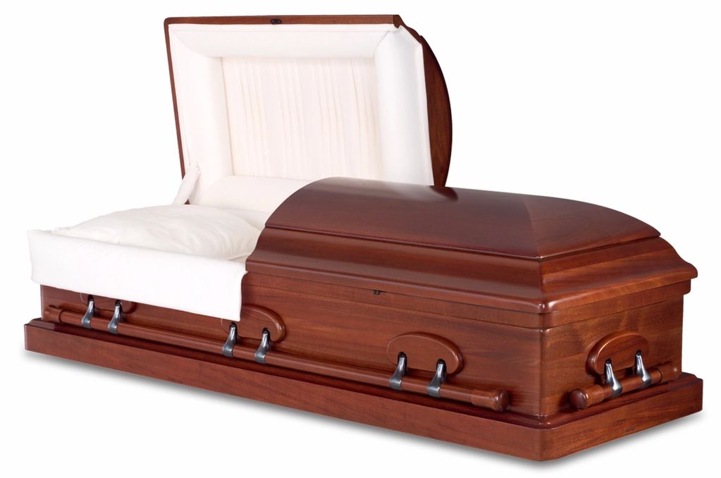 Open wooden coffin with white interior.