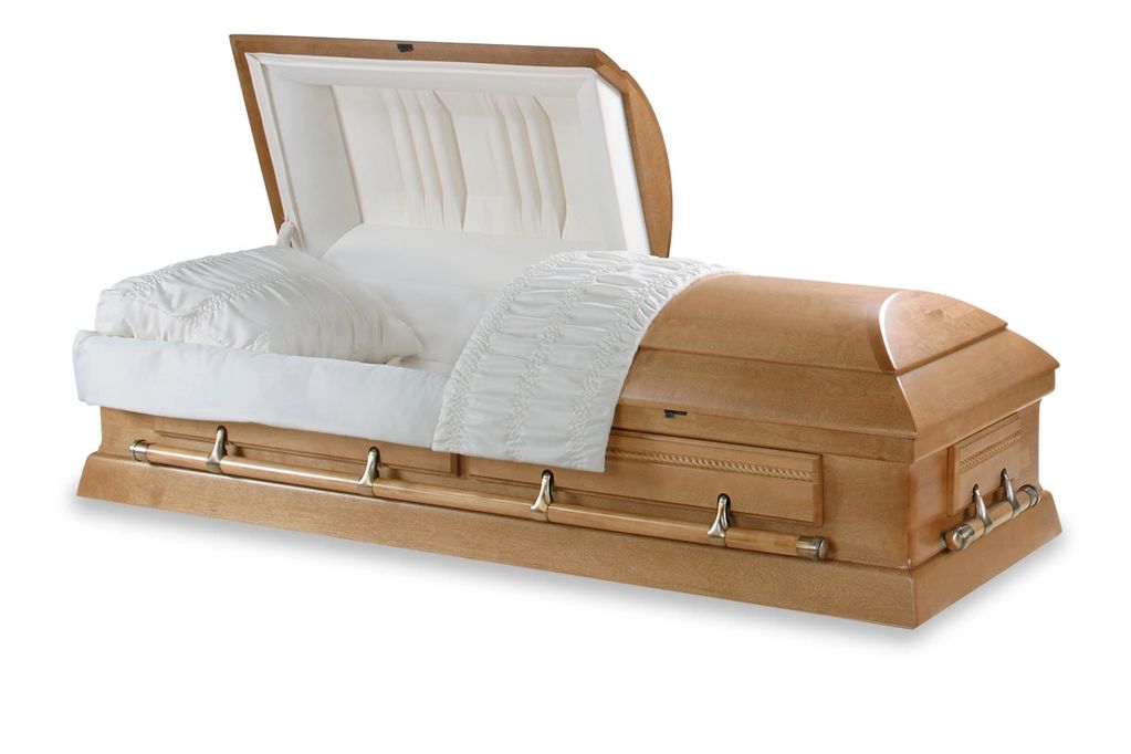 Open wooden coffin with white interior.