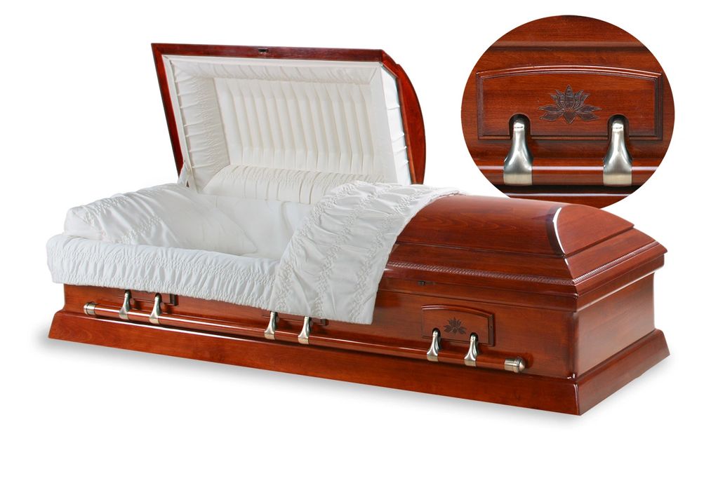 Polished wooden coffin with white interior lining.