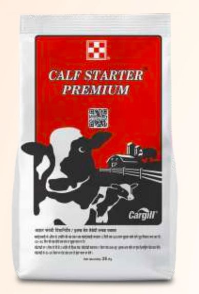 Bag of Calf Starter Premium feed with cow illustration and farm scene.