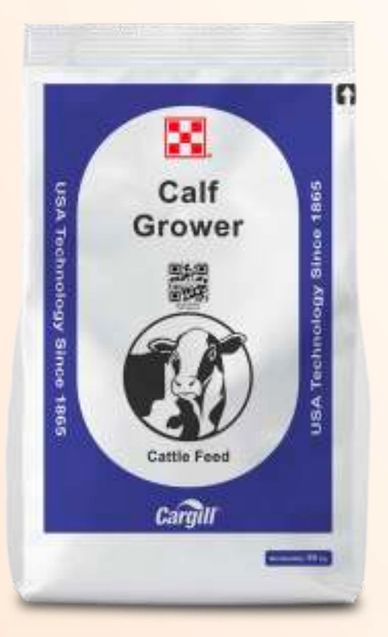 Bag of Calf Grower cattle feed with cow image and Cargill branding.