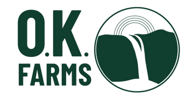 Logo for O.K. Farms featuring a waterfall and rainbow.