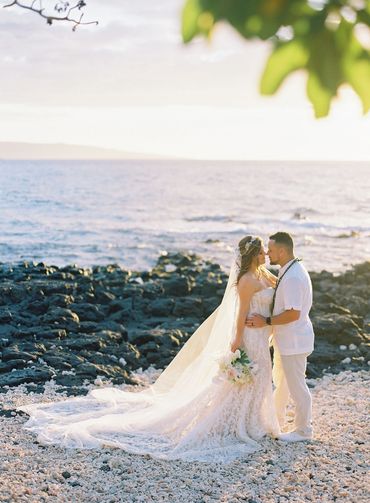 Couple gazing into each other's eyes on the beach