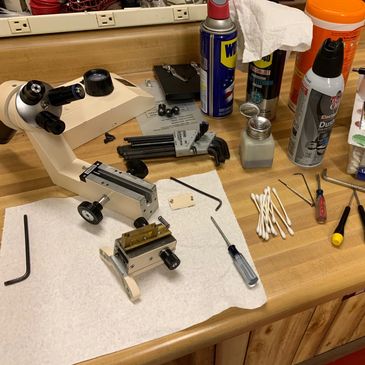 Work bench with microscope being worked on