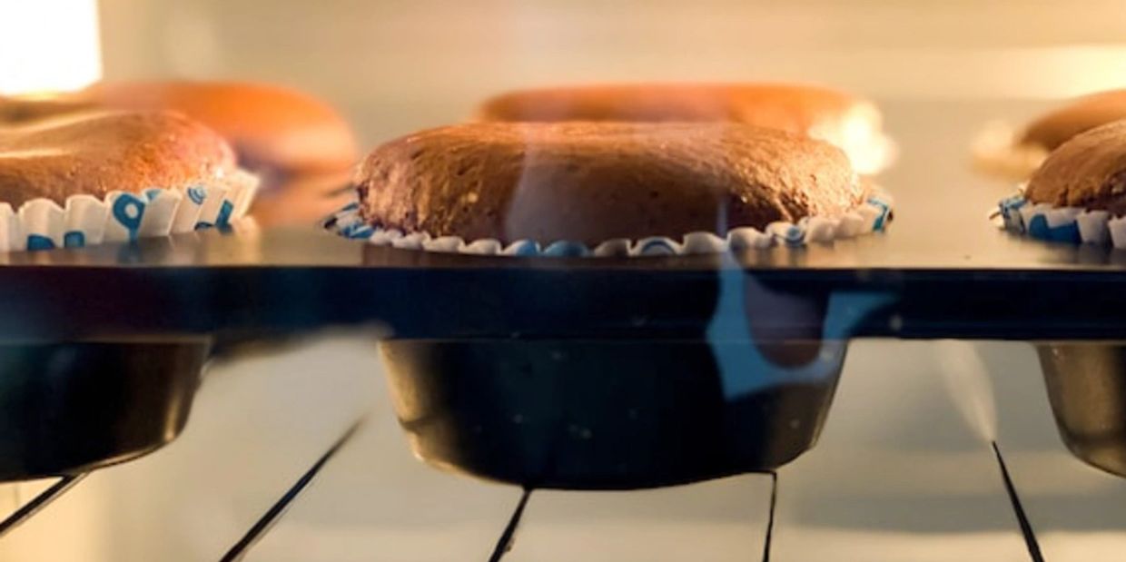 Chocolate cupcakes baking in the oven