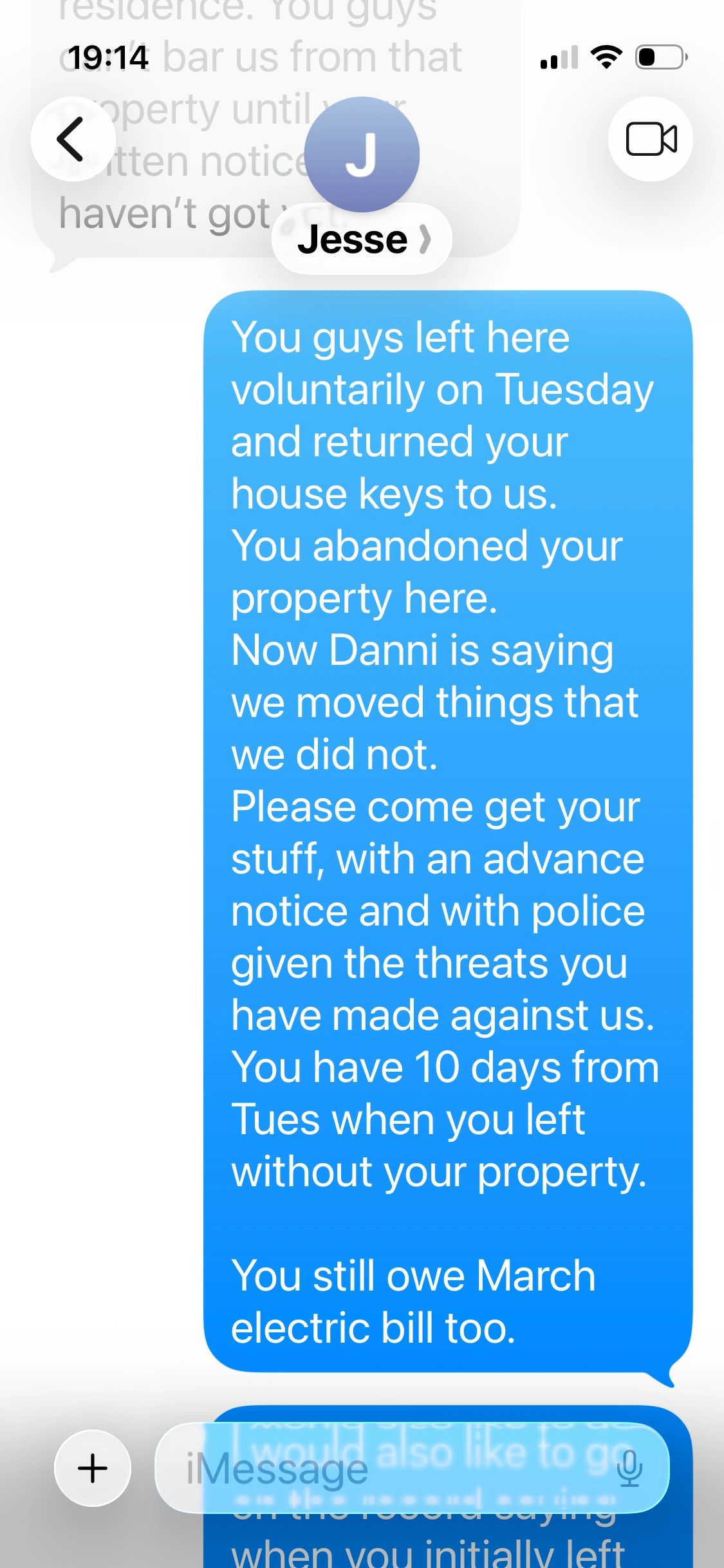 Text message about property abandonment and retrieving belongings with police notice.