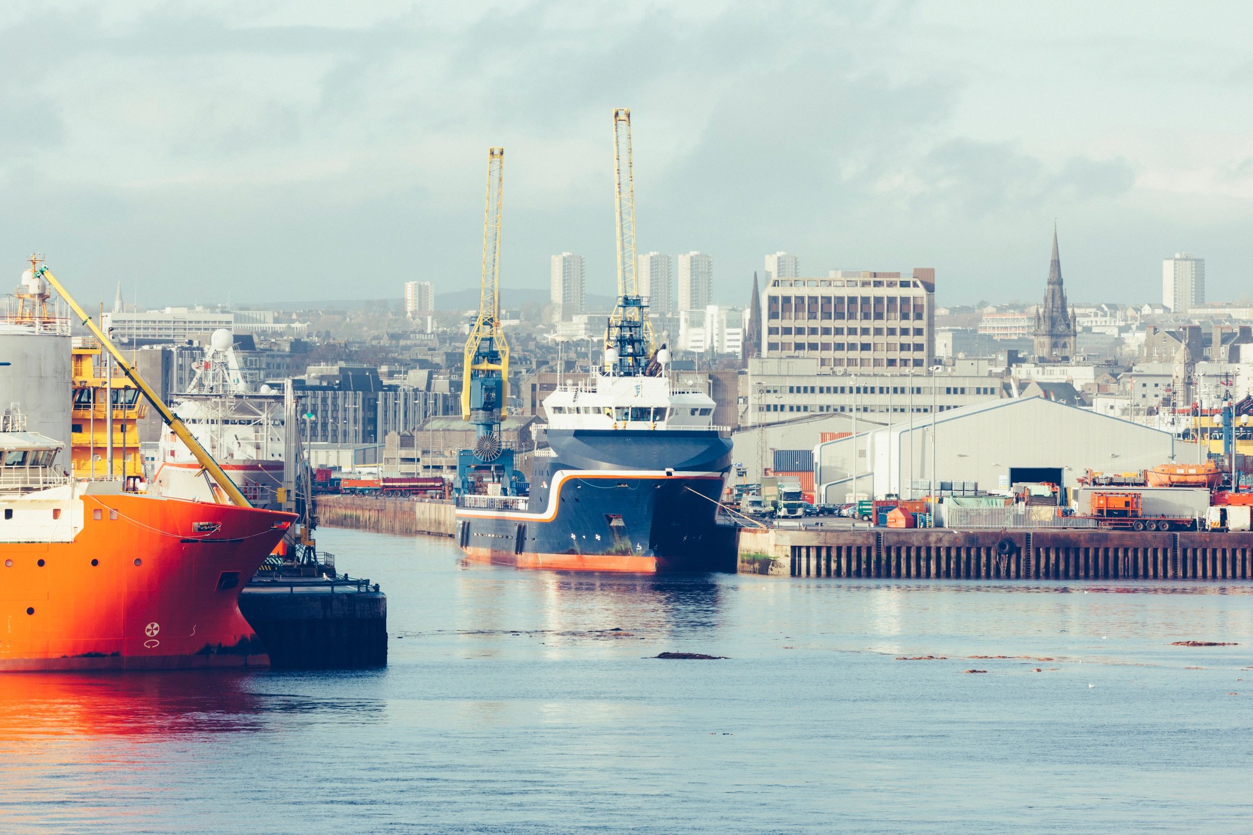 Aberdeen City harbour, featuring oil tankers and granite buildings in the background