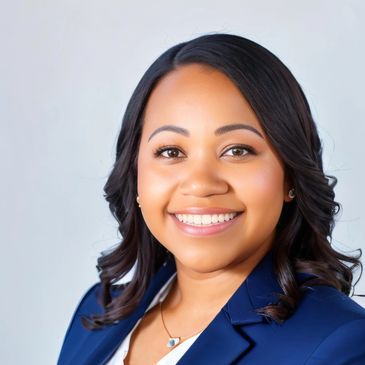 A smiling woman in a blue blazer with styled hair against a plain background.