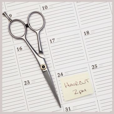 Mitchell's Hair Salon Date Book with scissors sitting on top - Flexible Appointments