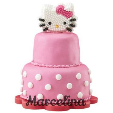 Pink two-tier Hello Kitty cake with polka dots and bow.