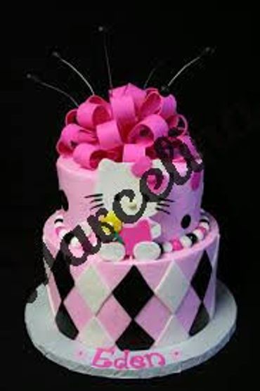 Two-tier pink and black birthday cake with bow and name Eden.
