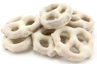 A pile of white chocolate-covered pretzels on a white background.
