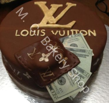 Chocolate Louis Vuitton-themed cake with edible wallet and money details.
