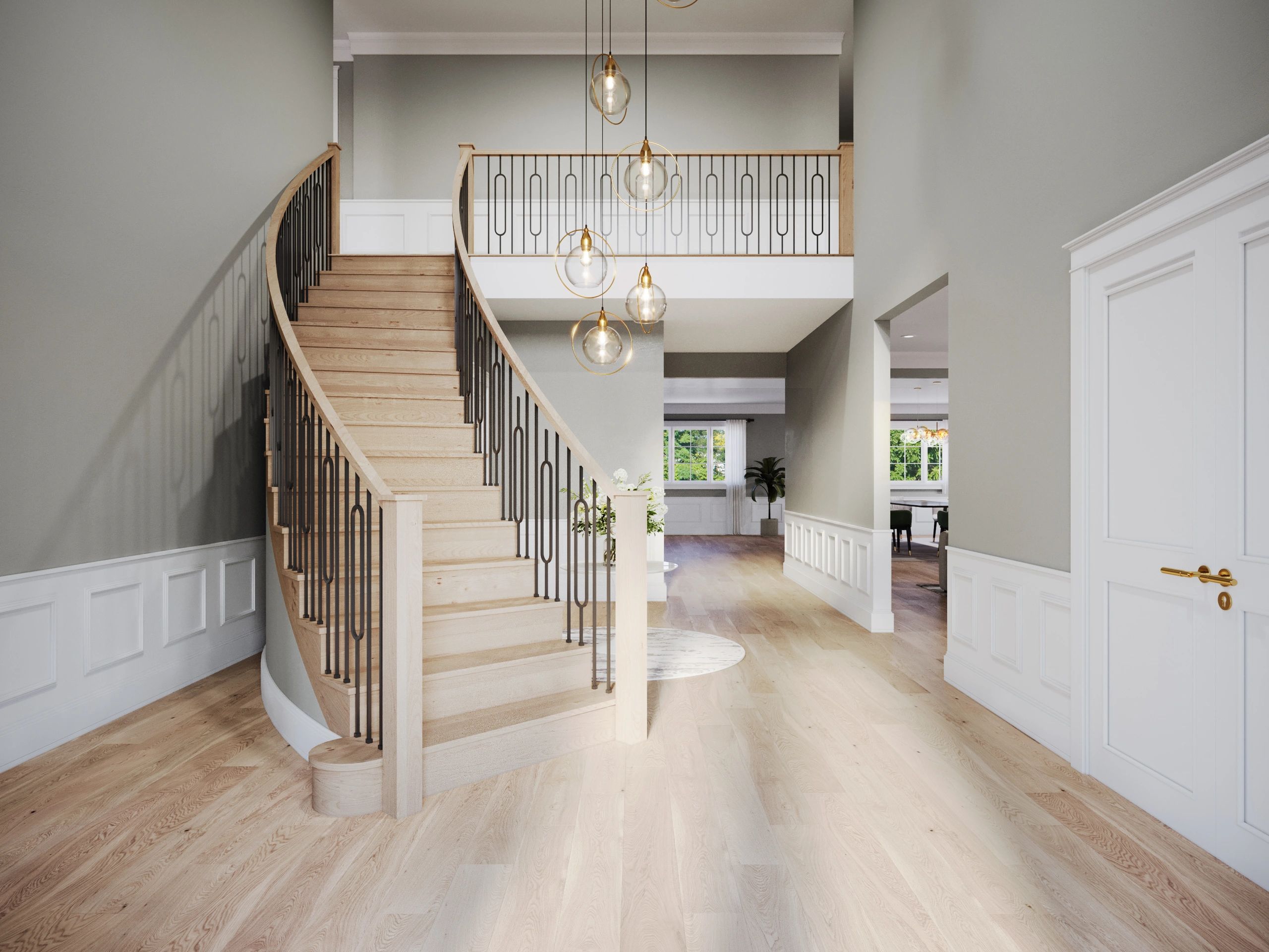 Elegant wooden staircase with modern pendant lighting in a bright, spacious foyer.