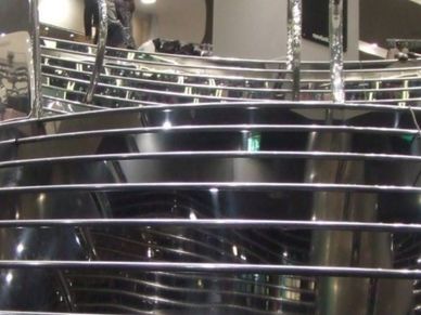 Shiny metallic bars reflecting light indoors.