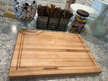 Solid maple cutting board with juice grove.