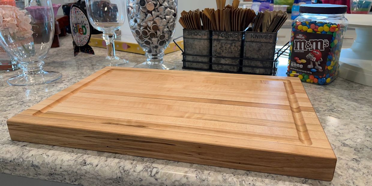 Solid maple cutting board with juice grove.