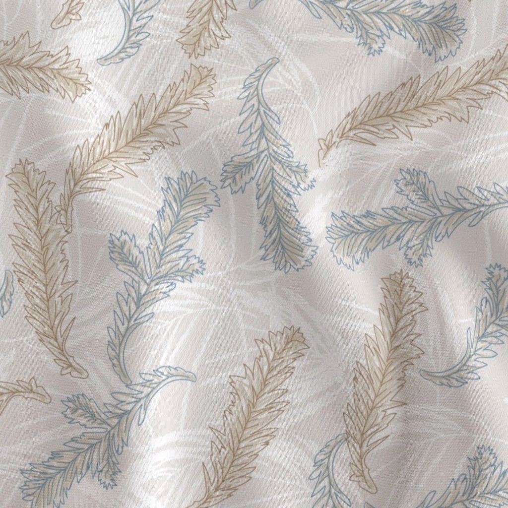 Soft fabric with beige and blue leafy pattern on a light background.