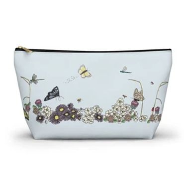 Floral and butterfly printed zippered pouch.