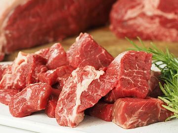 Chunks of tasty Diced Beef with garnish. Born & reared in Malpas.