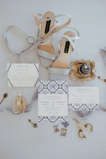 blue wedding flatlay with invitation suite