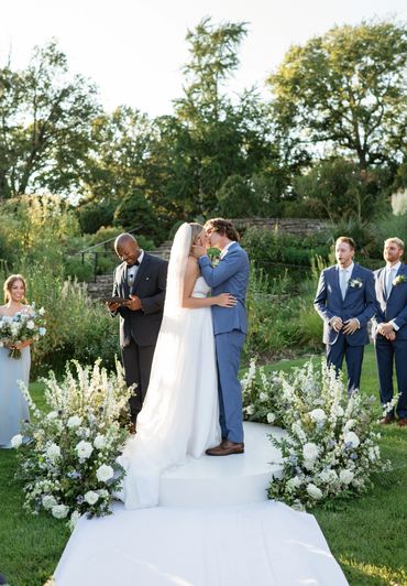 Blue and white wedding ceremony, couple at altar