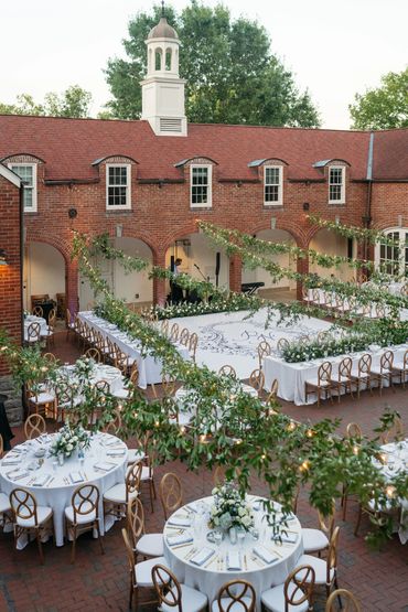 blue and white wedding reception space in garden courtyard