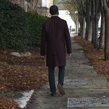 Man walking along paved path