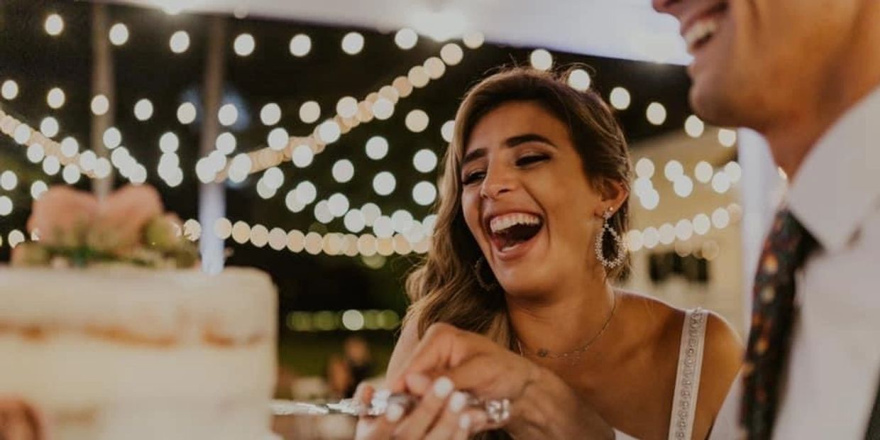 Happy Couple Cutting Wedding Cake