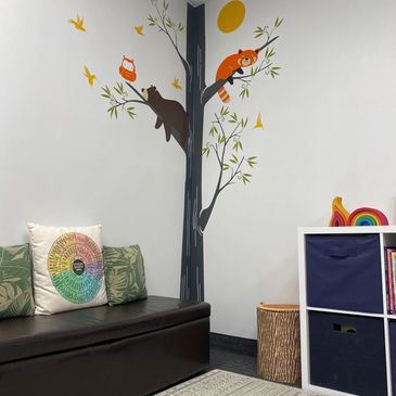 Speech therapy for children. Mural with cozy animals & toys in the playroom at The Talking Place