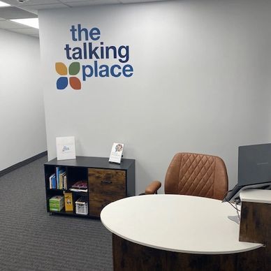 Speech Therapy in Minneapolis. Picture of welcome desk in the Talking Place lobby in front of large 