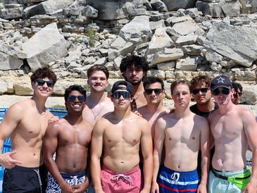 Aggie Business Kings members smiling on a boat.