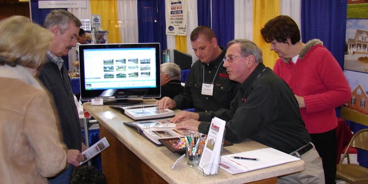Mike Hamrick and his family representing Hamrick Construction at the Home Builders Show—showcasing o