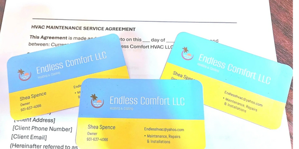 Three business cards sitting on top of service agreement form.