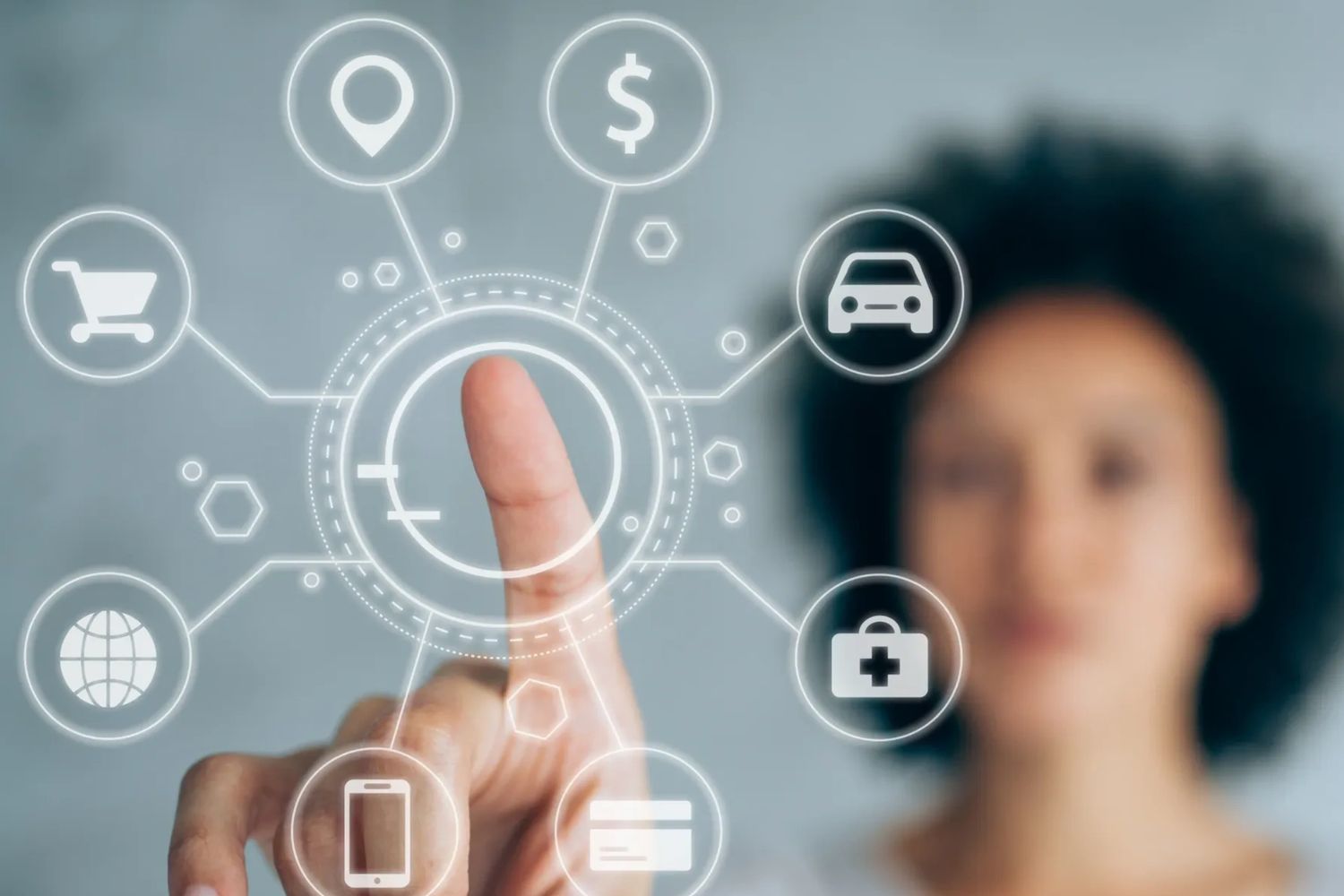 Person interacts with virtual icons representing technology and finance.