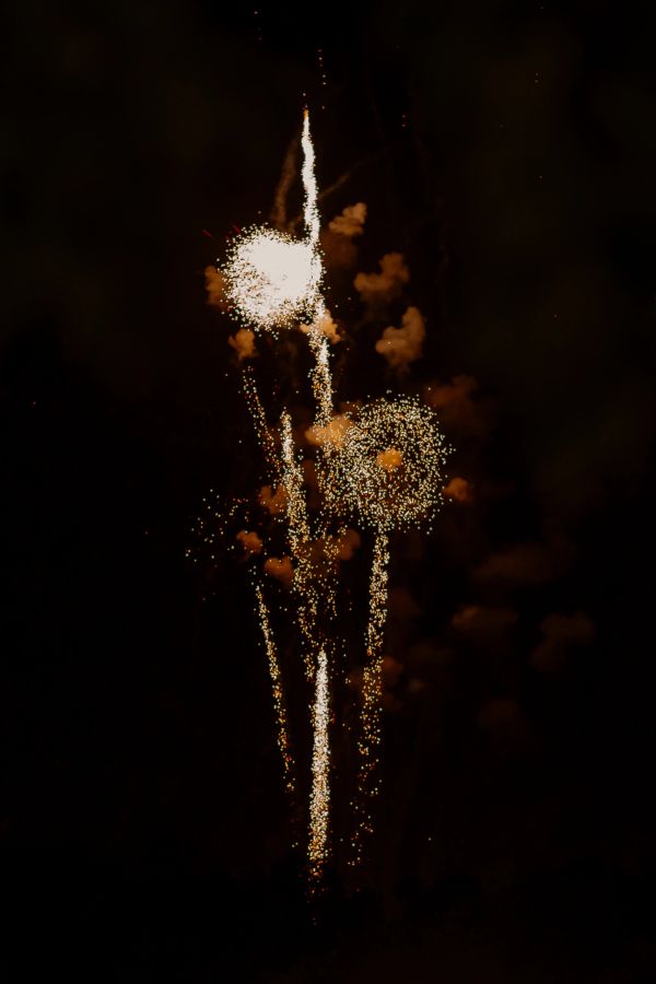 Bright fireworks against a dark night sky.