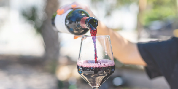 red wine being poured at an event