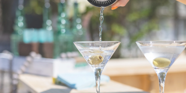 cold martini being served on a mobile bar top