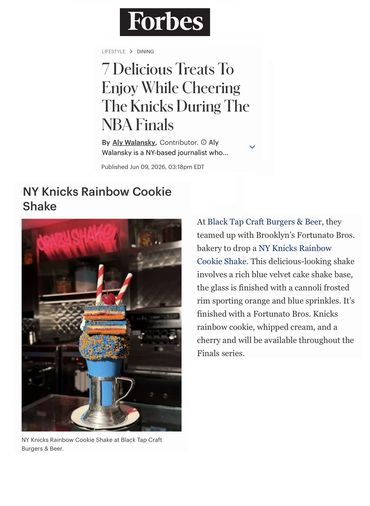 NY Knicks Rainbow Cookie Shake topped with colorful sprinkles and whipped cream.