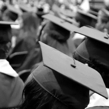 Black and White photo of students in graduation attire.