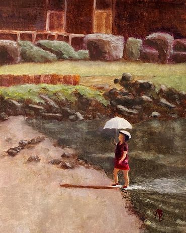 A girl walks onto the beach from the Benicia CA Bay holding her white umbrella.