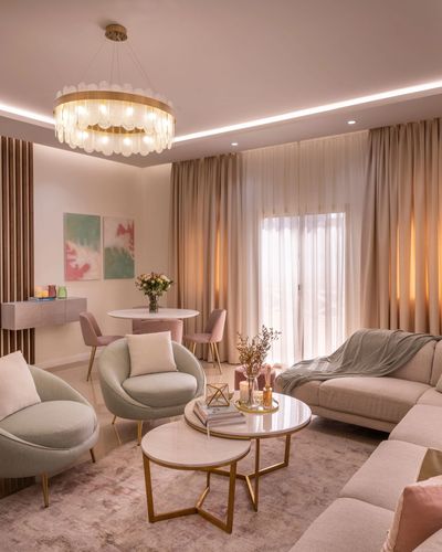 Clean lines and pops of teal create a chic haven in this modern living room.