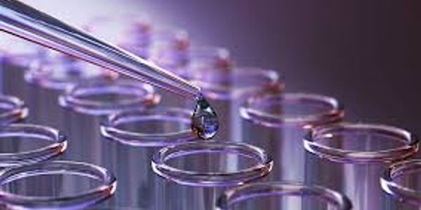 Pipette dropping liquid into test tubes.