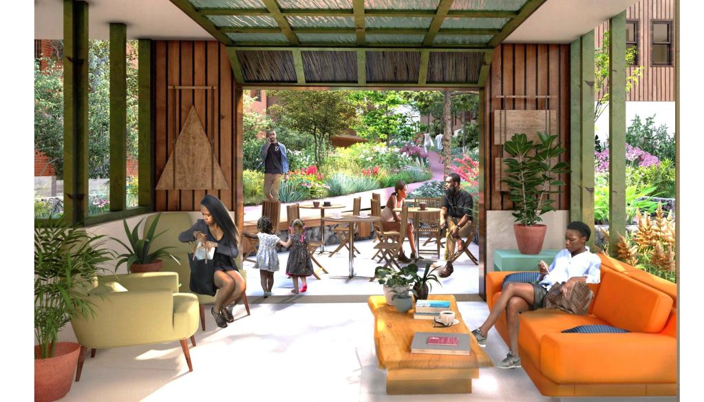 People relaxing in a cozy, plant-filled lounge area with an outdoor garden view.