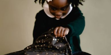 Elementary Student Searching Backpack